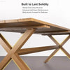 Wooden table with criss-cross leg structure.