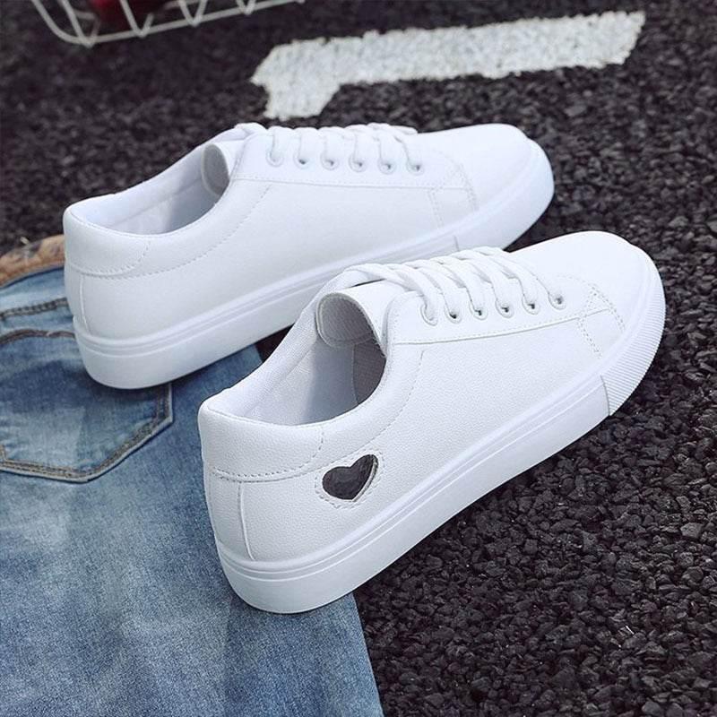 Heart Throb Kicks: Steal Hearts with Every Step Alright, check out these super cute sneakers! These white canvas kicks with red heart cutouts - Estalios