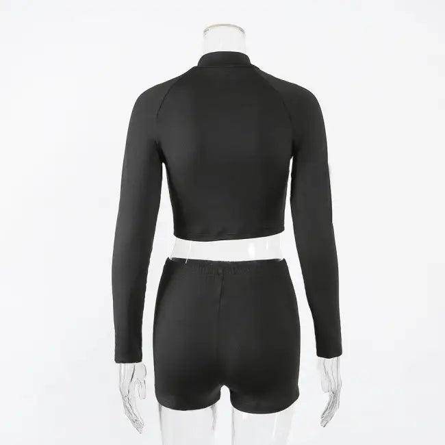 Amp Up Your Workout in the Bold Black Crop Set - Estalios