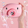 Pink pig-shaped bubble camera.