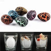 Cracked dinosaur egg toys and hatching process.