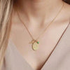 Gold necklace with charms.
