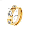 Gold ring with three embedded gemstones.
