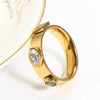 Gold ring with embedded stones.