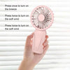 Pink handheld fan.
