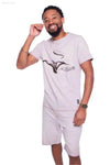 Man in matching lavender t-shirt and shorts.