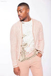 Man in pink cardigan and pants.