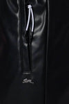 Black faux leather pants with drawstring and rabbit logo.