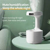 White humidifier with digital clock.