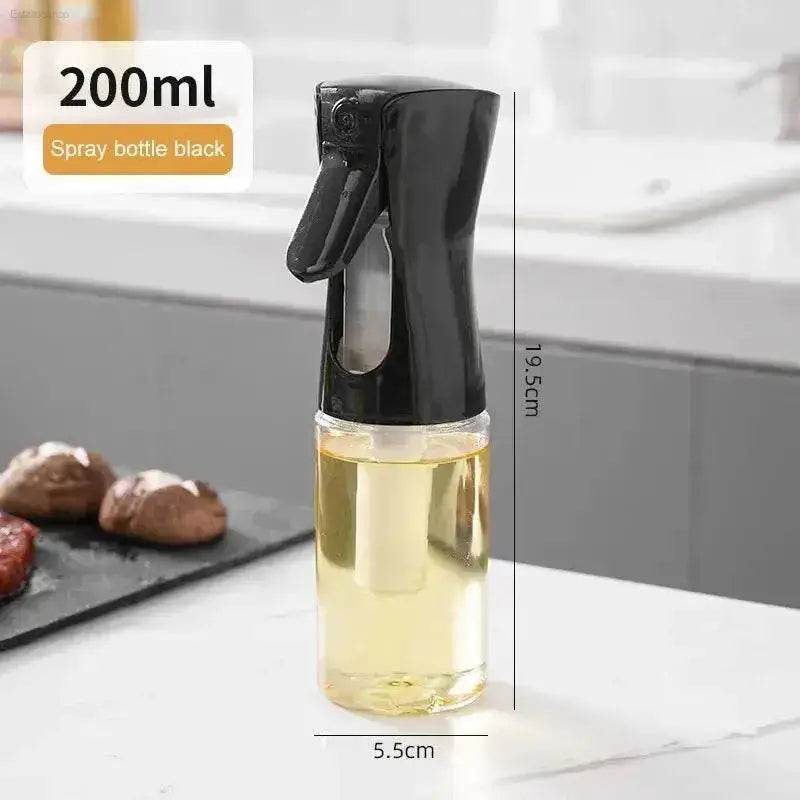 Black spray bottle with clear body.
