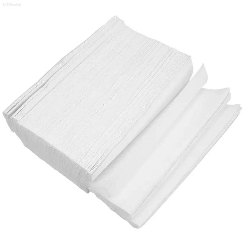 Stack of white paper towels.