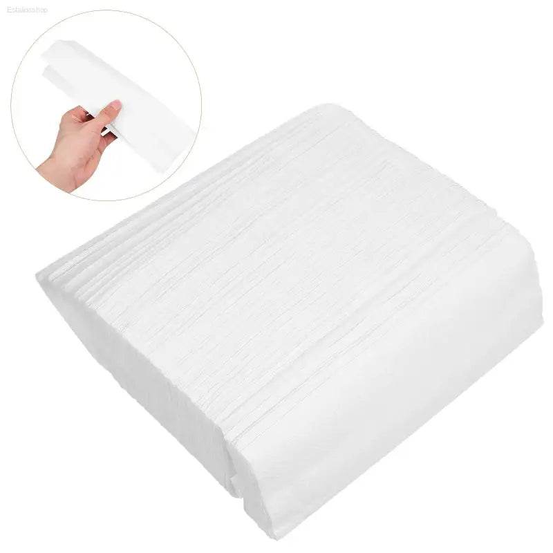 Stack of white paper towels.
