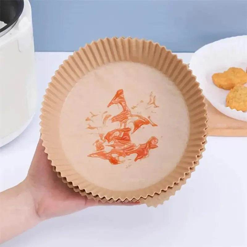 Round, brown, disposable air fryer liners.
