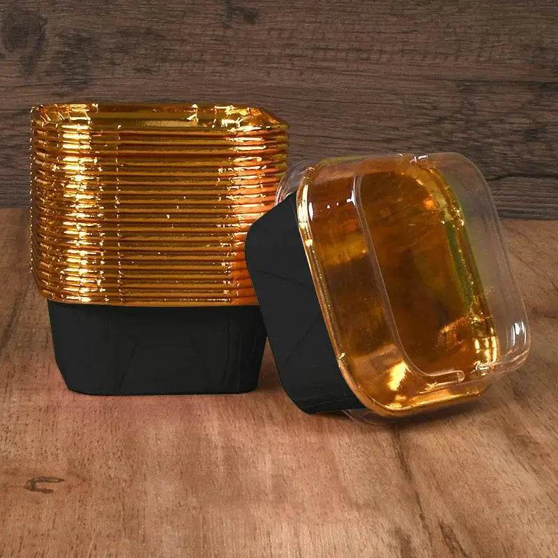 Black and gold food containers.