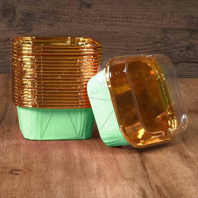 Gold-lined green disposable food containers.