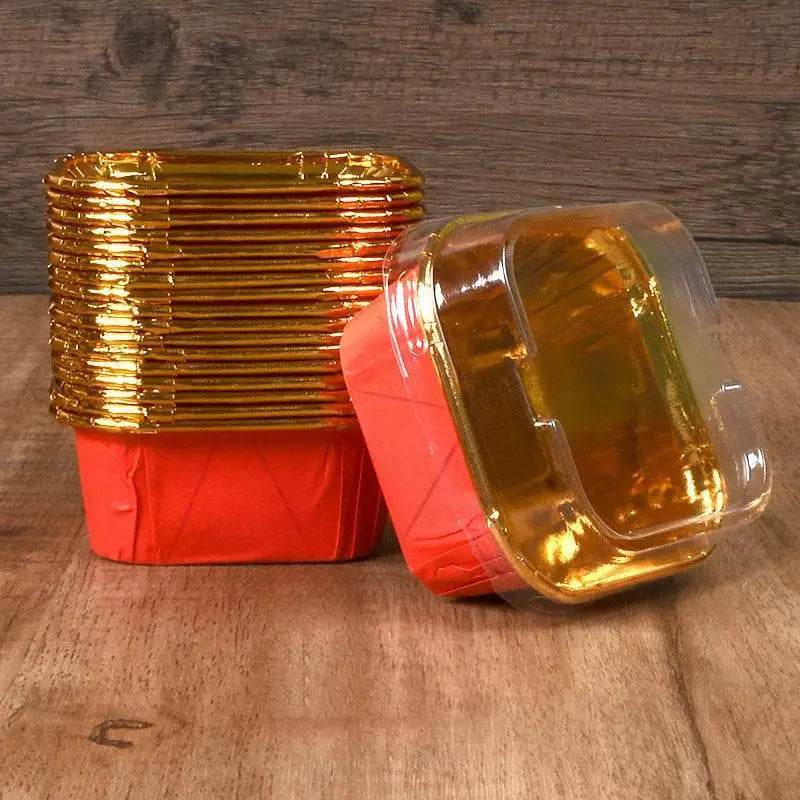 Stack of orange and gold square containers.