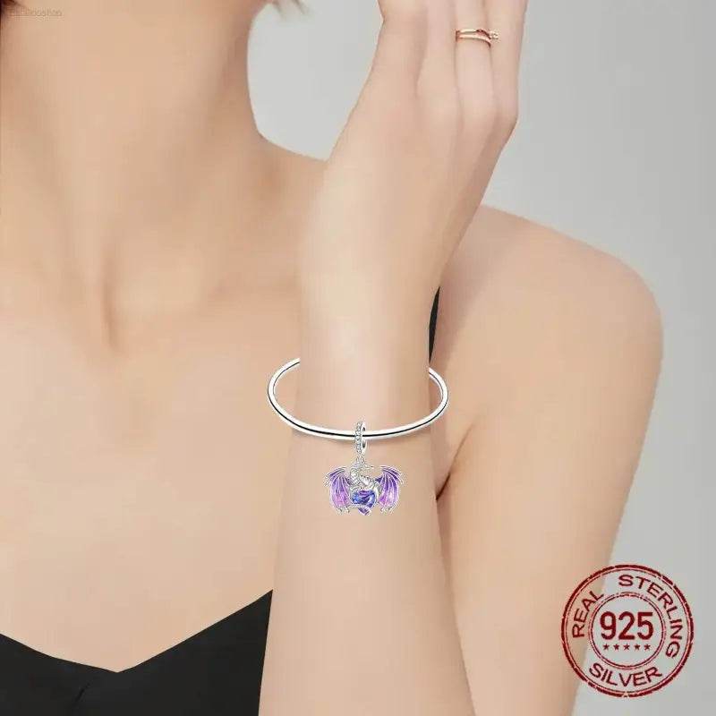 Silver dragon charm bracelet.