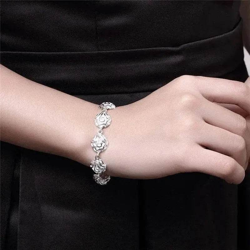 Silver floral bracelet.