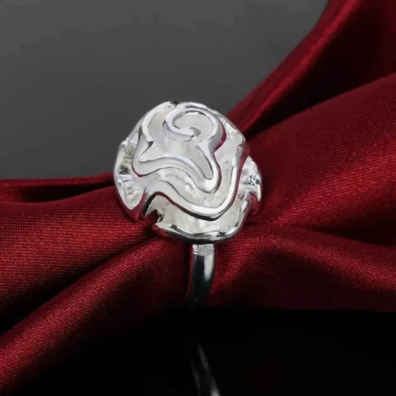 Silver rose ring.