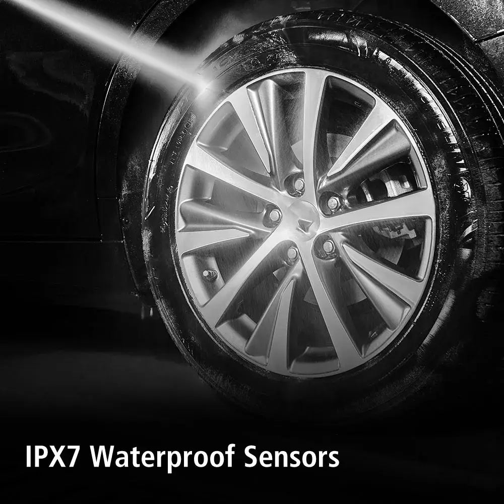 Car wheel being washed with Tire Pressure Monitoring System in view for safety.