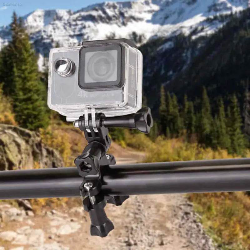 Action camera mounted on a handlebar clamp.