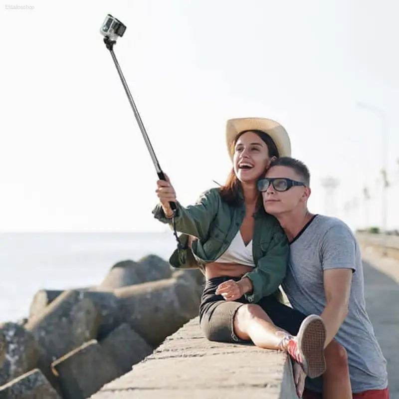 Couple taking selfie with action camera.