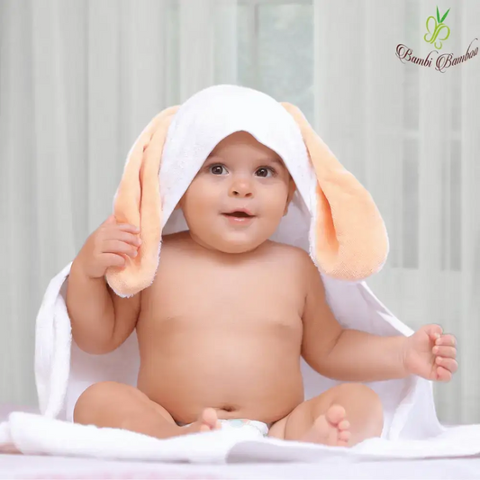 Cute baby wrapped in an Amber Bunny Hooded Towel with bunny ears. Perfect baby hooded towel!