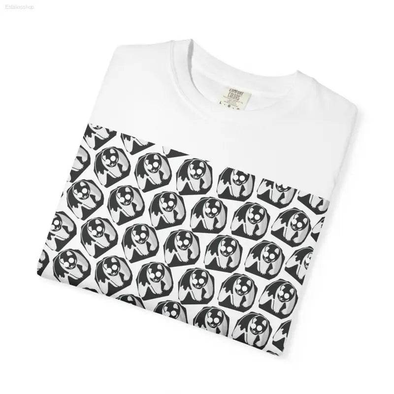 White t-shirt with soccer ball pattern.