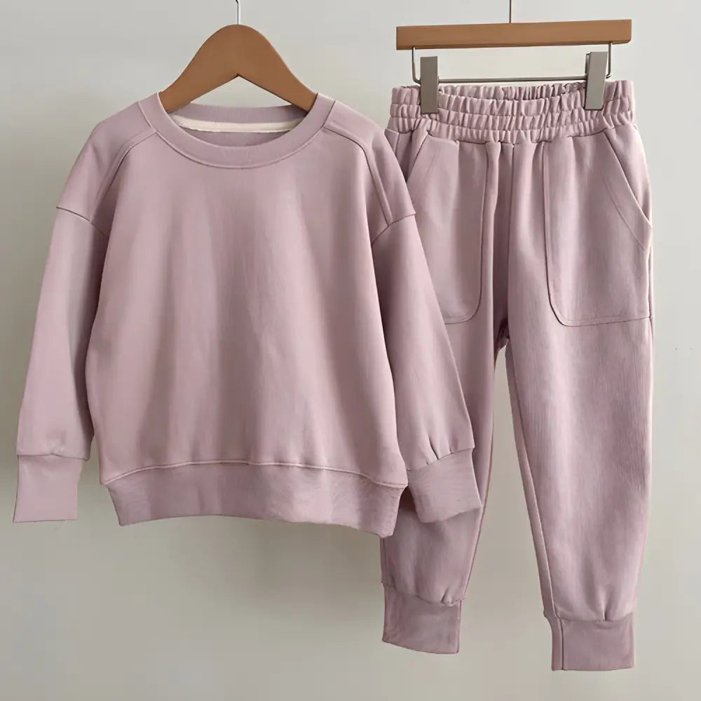 Cute matching mauve sweatshirt and sweatpants set from Autumn Baby Kids in dark blue