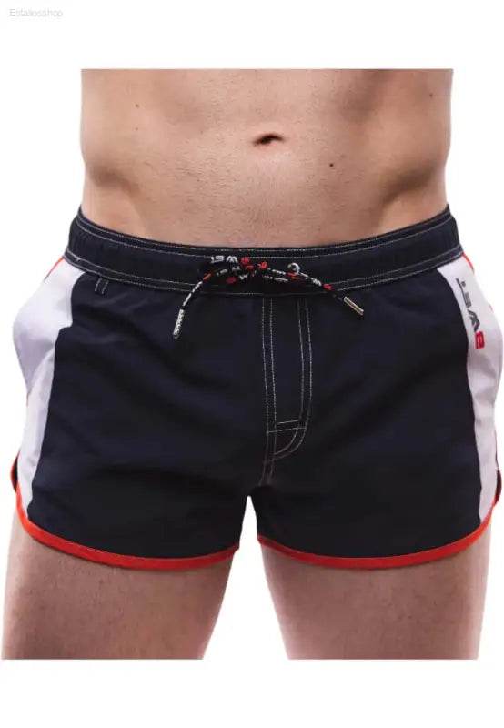 Men’s navy swim trunks with red trim.
