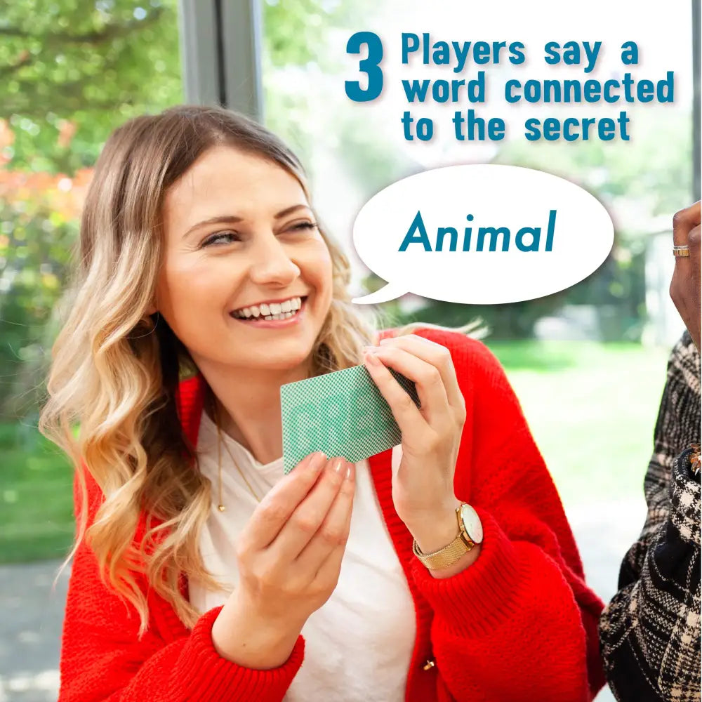 Smiling woman with green cards enjoying Big Potato’s Extra Secret Words game fun