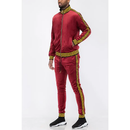 Burgundy velvet tracksuit featuring a gold Greek key pattern for a luxurious vibe