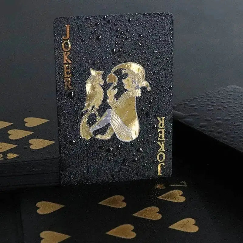 Black joker playing card with gold accents from Black Gold Playing Cards Luxe waterproof group