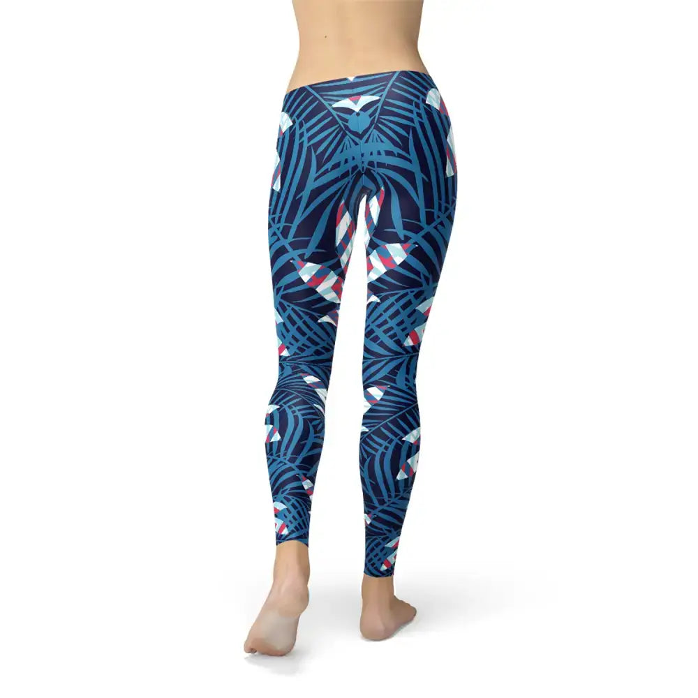 Blue Tropical Leaf Leggings featuring a vibrant blue patterned design with tropical leaves