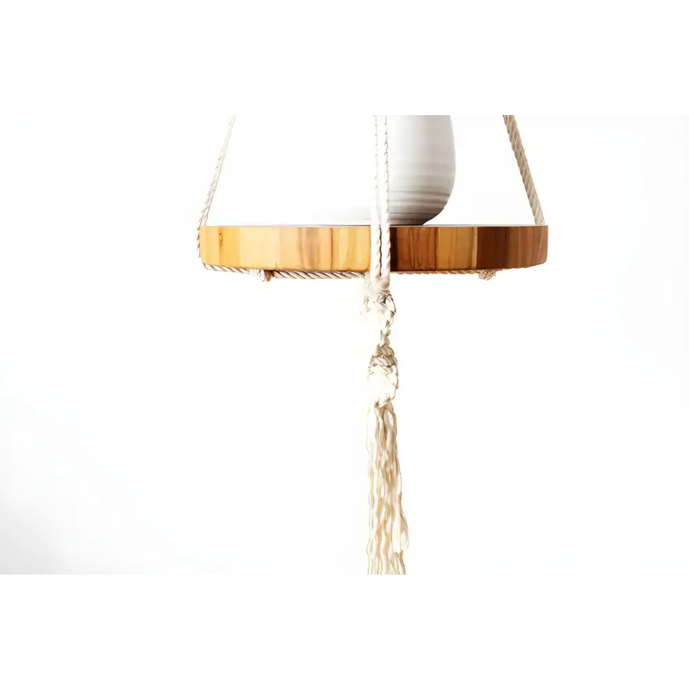 Hanging wooden shelf with macrame tassel for stylish plant macrame display