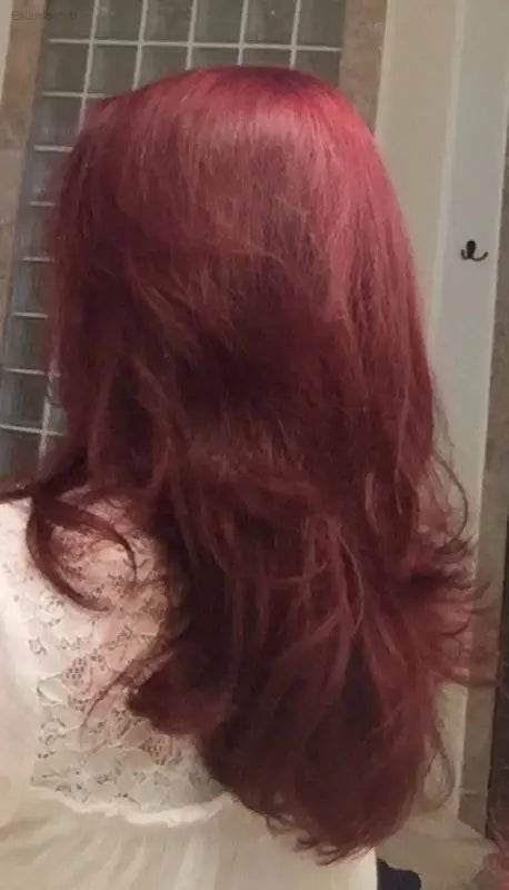 Long, layered, burgundy hair.