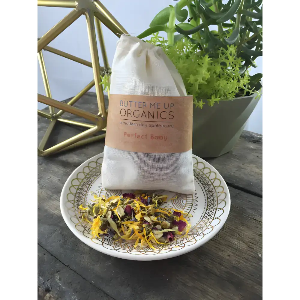 Cloth bag filled with organic rose petals for the ultimate baby organic bath experience