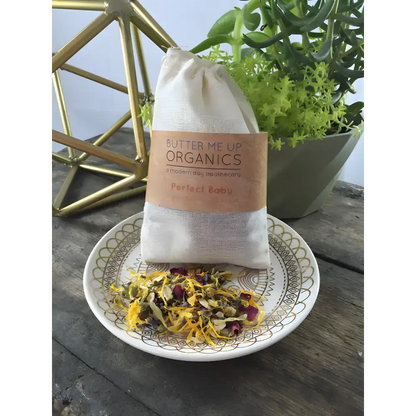 Cloth bag filled with organic rose petals for the ultimate baby organic bath experience