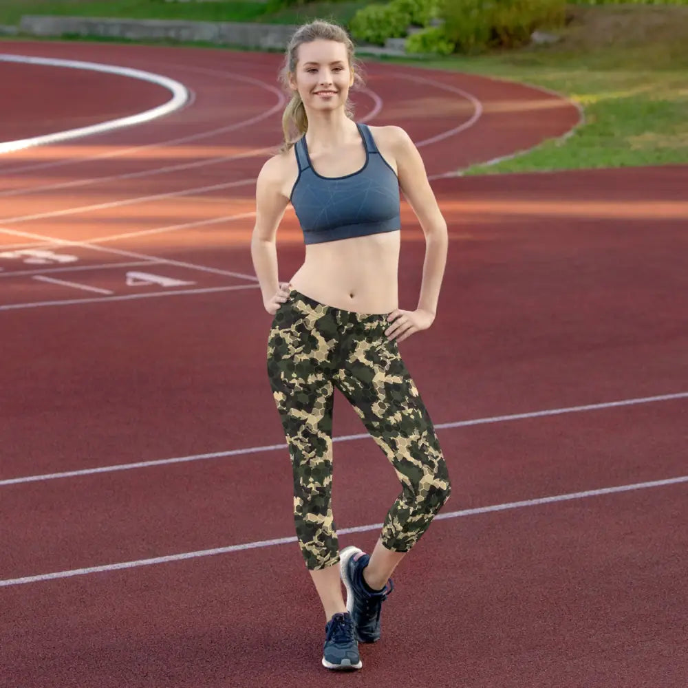 Woman in athletic wear rocking Camo Capri Leggings Unleashed for a stylish workout