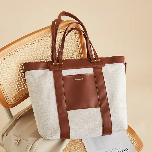 Chic Canvas Tote Diaper Bag in brown and white, perfect for a portable changing station