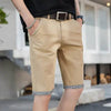 Khaki chino shorts with cuffed hem.