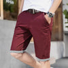 Maroon chino shorts with cuffed hems.