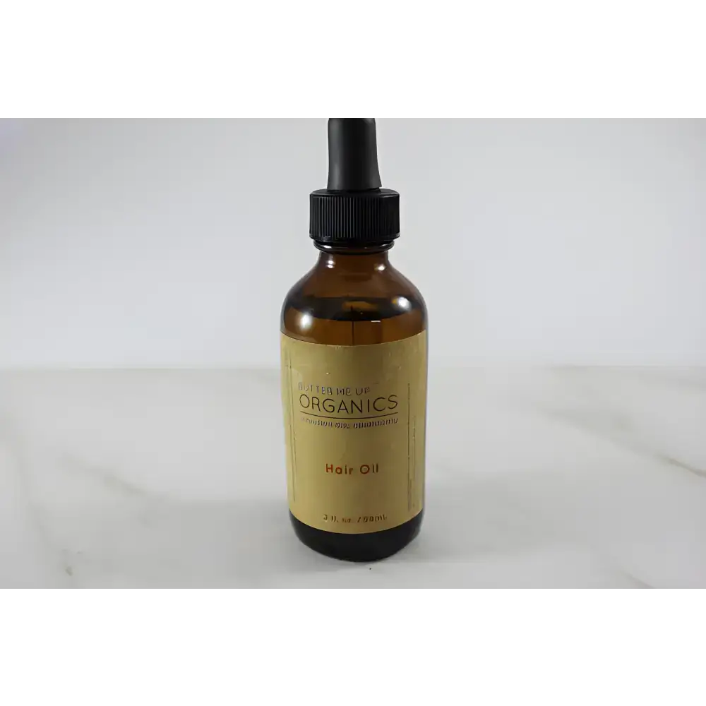 Amber glass bottle with dropper of Clary Sage Organic Hair Oil for hair oil repair