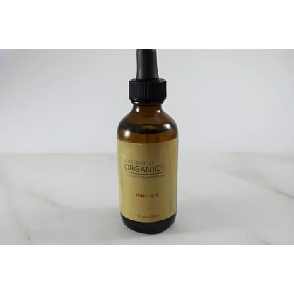 Amber glass bottle with dropper of Clary Sage Organic Hair Oil for hair oil repair