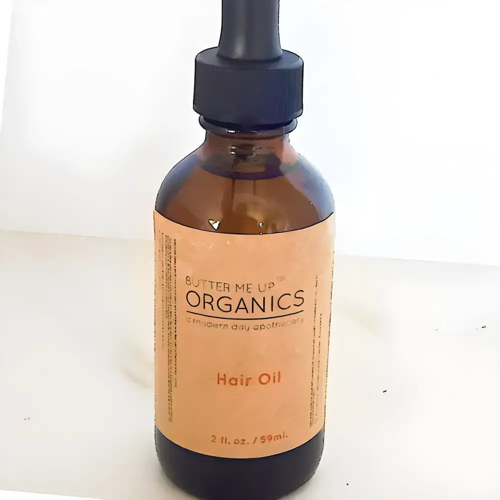 Amber glass bottle of Clary Sage Organic Hair Oil for hair oil repair