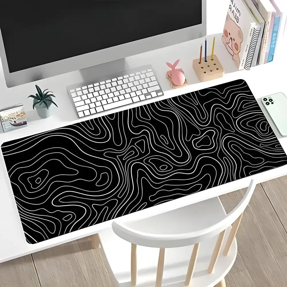 Black gaming mouse pad with white topographic lines for a sleek gaming setup