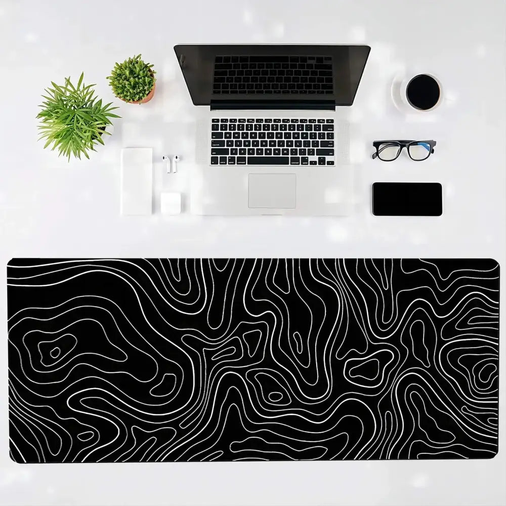 Black desk mat with white contour lines, perfect for a gaming mouse pad large setup