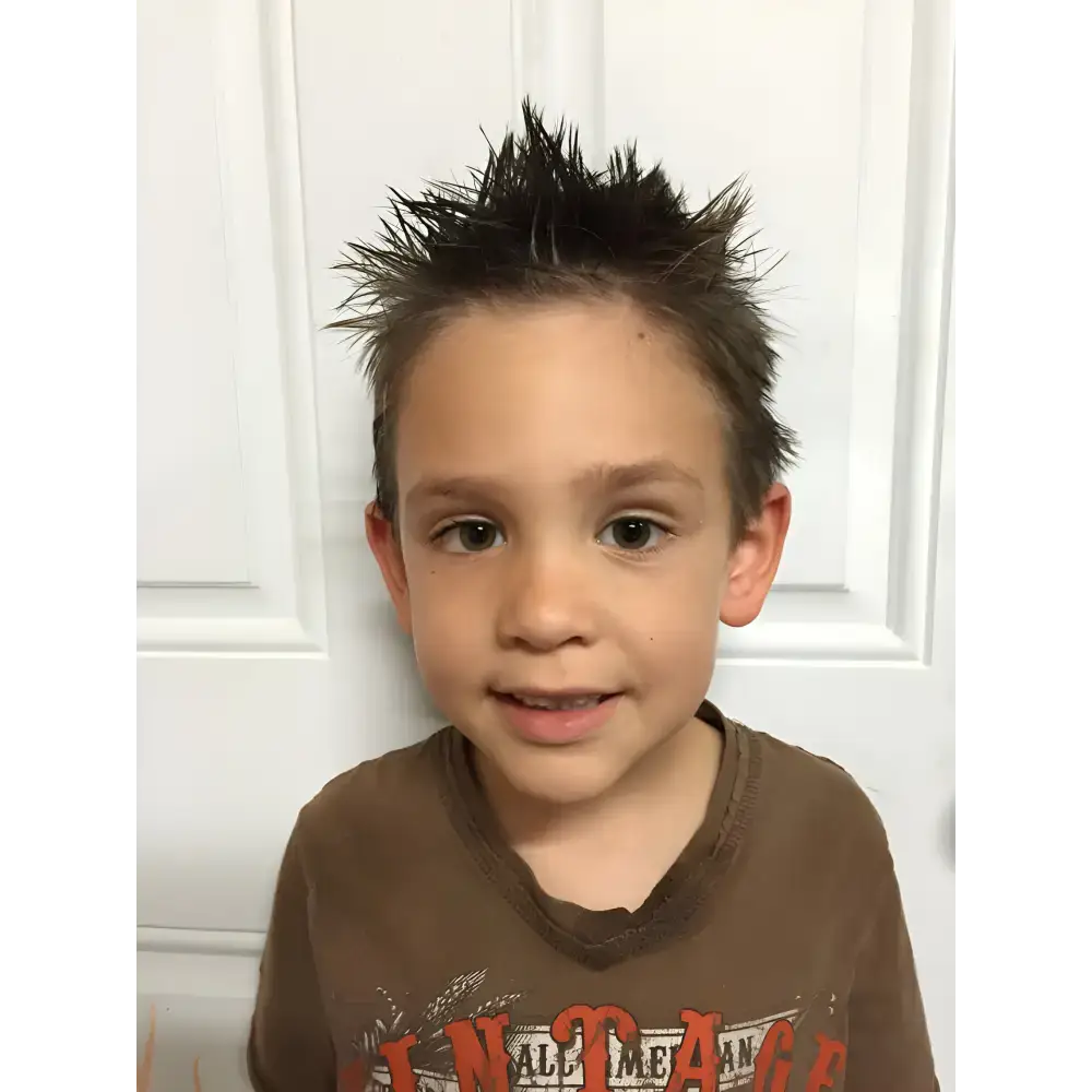 Cool Kid showing off spiky hair styled with Organic Pomade Hair Wax for a fresh look