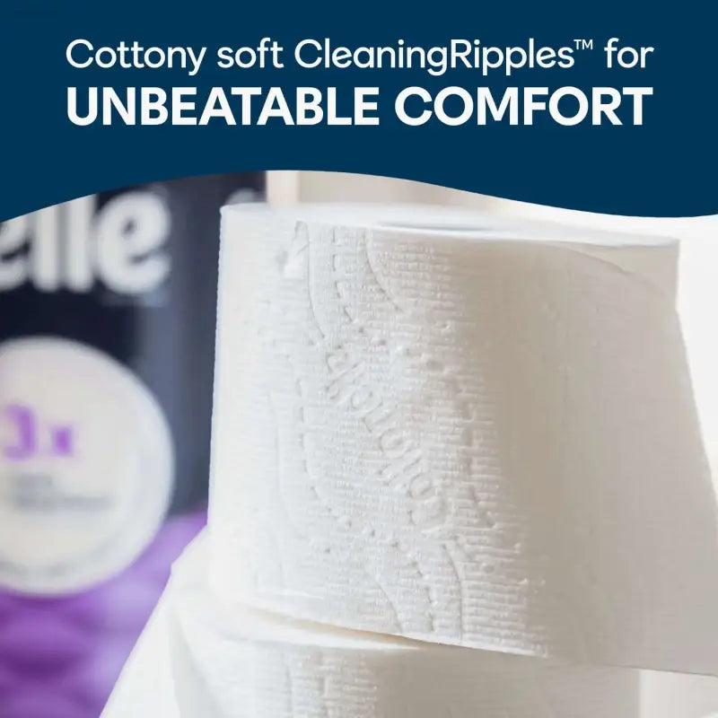 White, patterned toilet paper rolls.