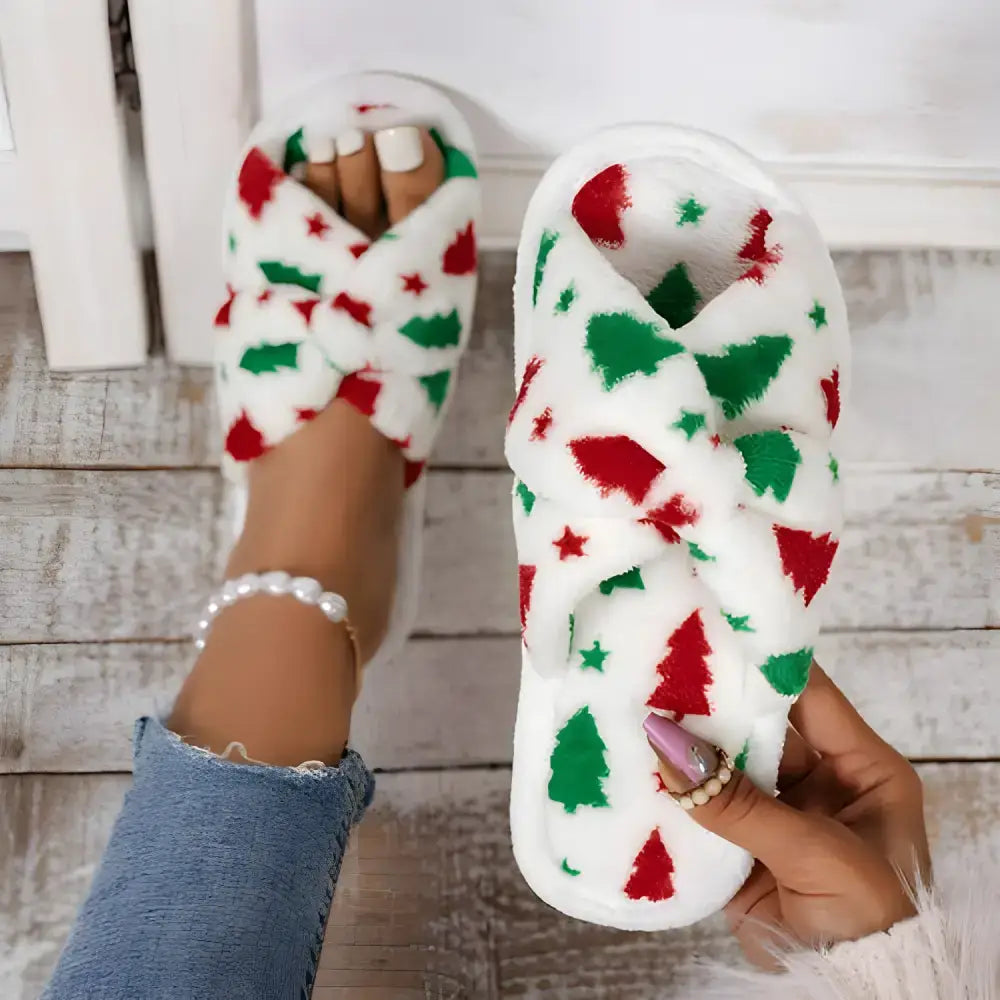 White Christmas-themed fuzzy slippers from Cozy Christmas Shoe Deals for Women